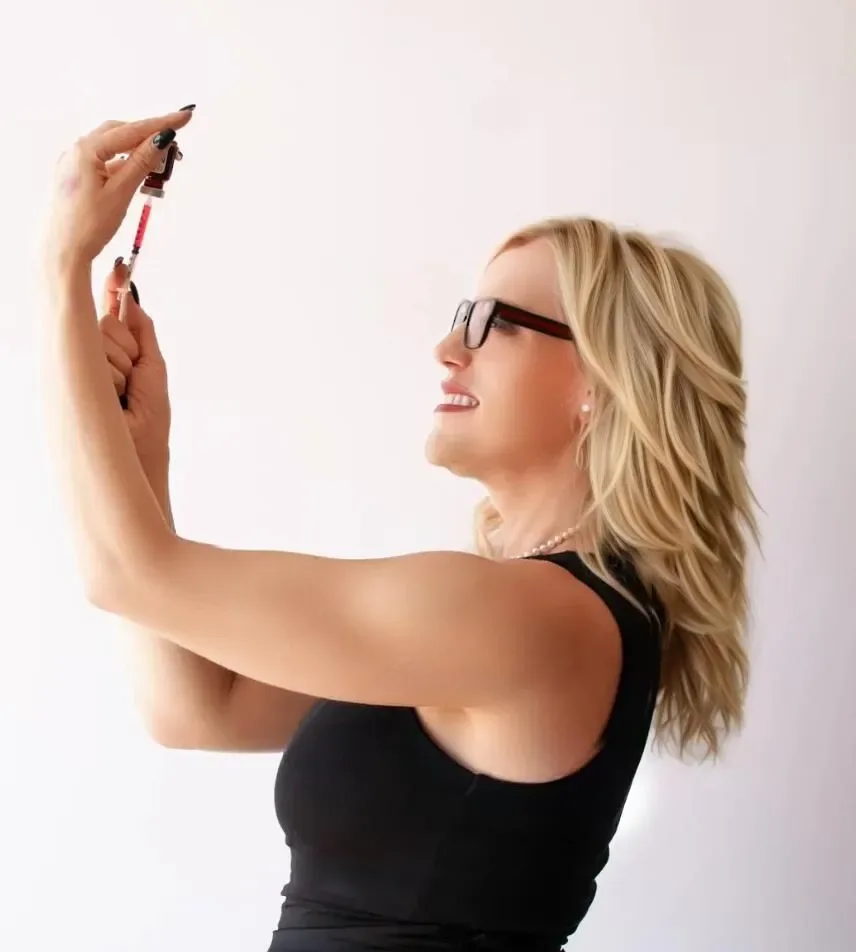 Woman looking up at a medical syringe pen for medically guided weight optimization